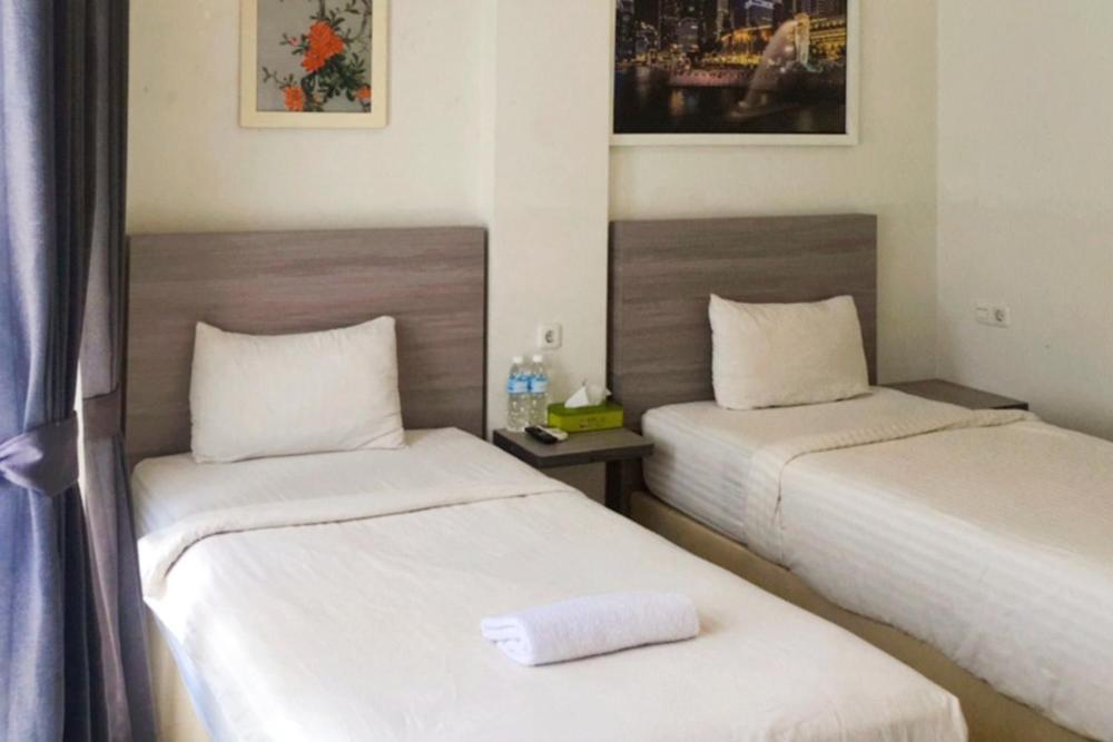 Twospaces Living At Maximus Inn Palembang Exterior photo